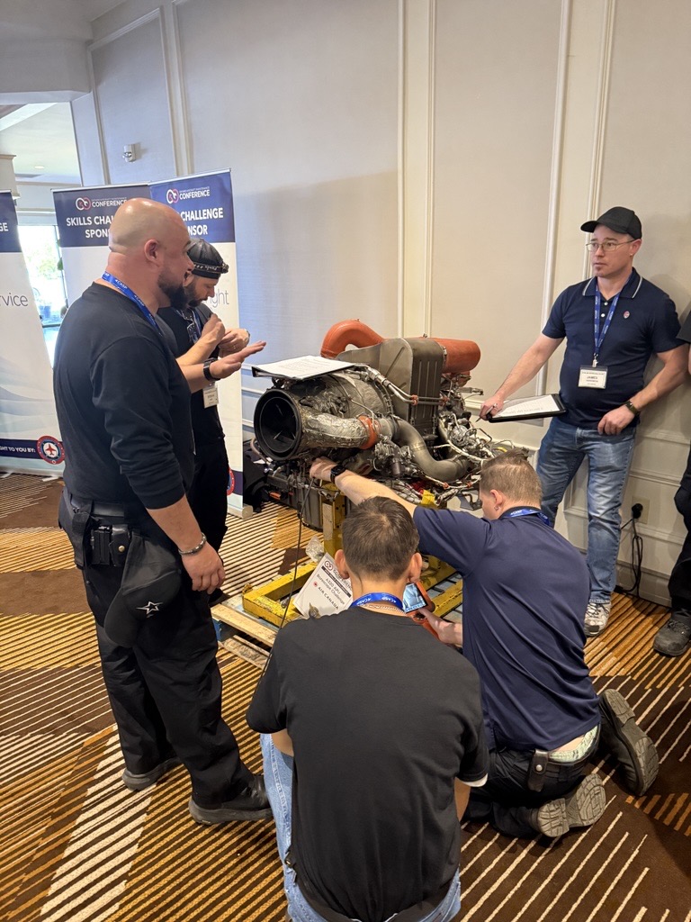 Technicians working on a turbine engine during the Skills Challenge